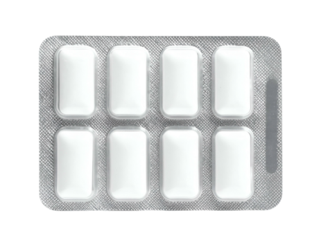 Close-up of eight rectangular white oral hygiene items in a silver blister pack