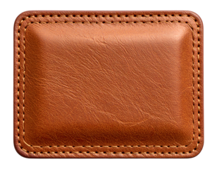 Rectangular brown leather patch, stitched border, gently curved interior. Isolated on black