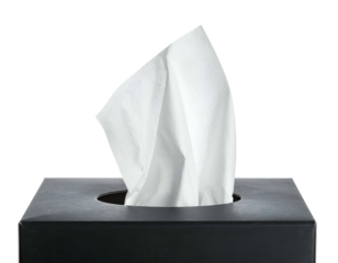 A close-up shot reveals a black box, housing a stack of white tissues