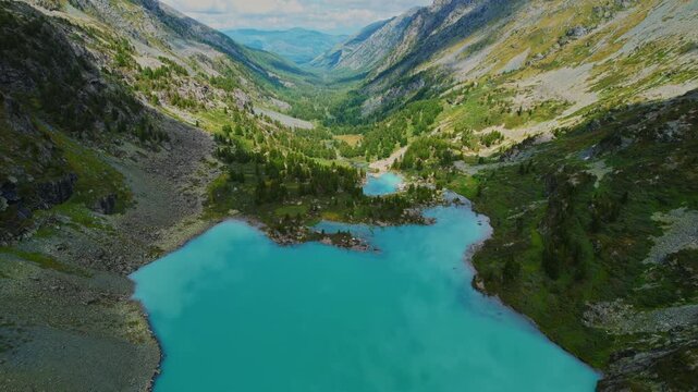 Aerial view nature landscape turquoise Kuiguk lake with clear blue water from glaciers in Altai mountains.