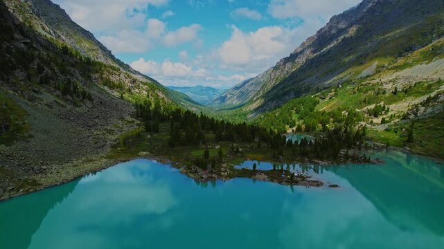 Aerial view nature landscape turquoise Kuiguk lake with clear blue water from glaciers in Altai mountains.
