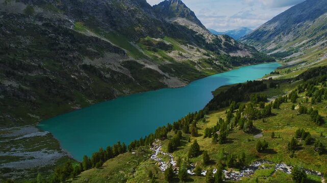 Aerial Summer beautiful Landscape Altai with high mountain lake with clear blue water from glaciers Poperechnoye Multinskoye.
