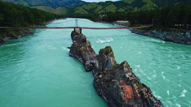 Aerial view Blue river Katun in Altay, Siberia Russia. Landscape popular tourist place Dragon Teeth and suspension bridge.