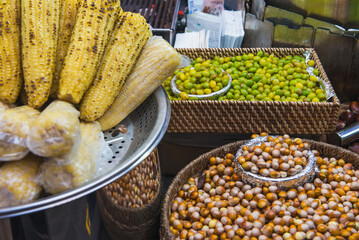 Grilled Corn and Fresh Nuts at Bustling Street Market