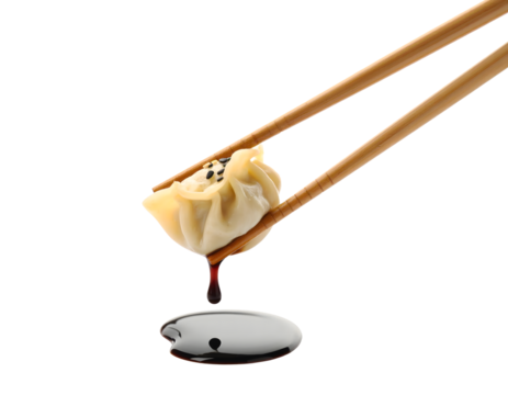 Delicious dim sum dumpling dipped in savory soy sauce by chopsticks, perfect for Asian cuisine and restaurant marketing