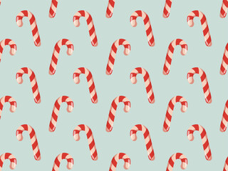 Seamless pattern with cartoon candy canes on blue background. Vector sweet Christmas background.
