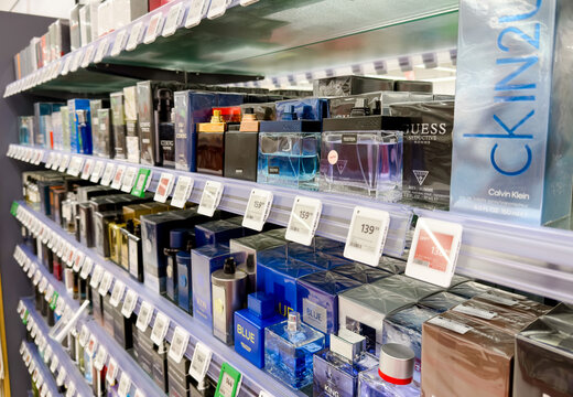10.19.2025, Żory, Poland. Perfume and fragrance shelf in Rossmann drugstore showing branded cosmetics and beauty products on display in local retail store