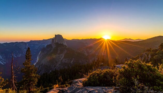 Scenic view of a mountain range, bathed in golden sunset light