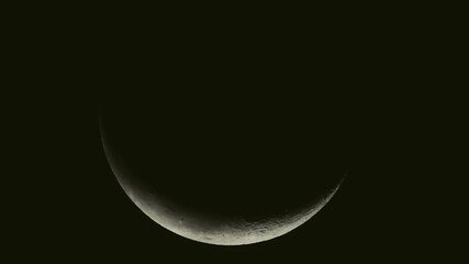Tokyo,Japan - October 18, 2025:  A waning moon covered with thin clouds at dawn
