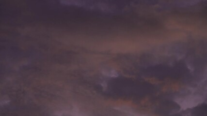 Tokyo,Japan - October 18, 2025:  Red clouds illuminated with the rising sun  