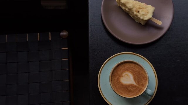 Chic topdown coffee and cake setup, Minimalist interior with geometric framing and muted tones
