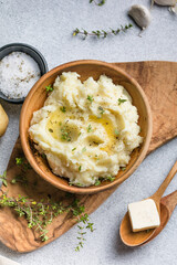 Mushed potatoes top view with raw potatoes and spices