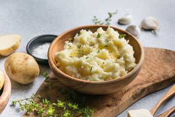 Mushed potatoes top view with raw potatoes and spices