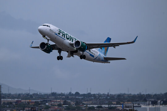 Sky Harbor Airport 10-11-2025 Phoenix AZ USAFrontier Airlines Airbus A320Neo N372FR departure from 7L at a rain soaked  Phoenix Sky Harbor Intl. Airport