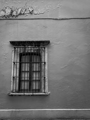 Minimal black and white architectural wall with window and texture
