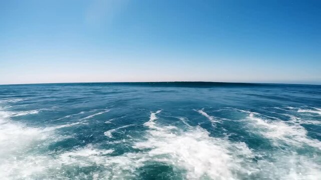 Dynamic handheld tracking shot capturing white-capped ocean waves rolling in succession under a vast, open sky wide shot, water, movement