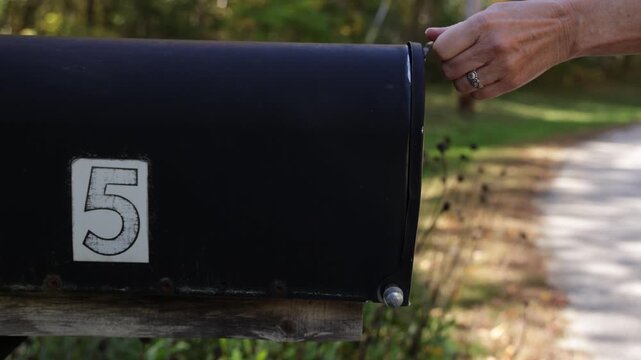 Female Checking Empty Rural Mailbox Slow Motion