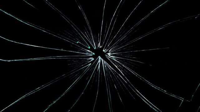 footage of broken glass, with a green screen background, Breaking glass motion graphics. Cracked glass fracture effect,
cracks glass fracture effect texture isolated abstract black background