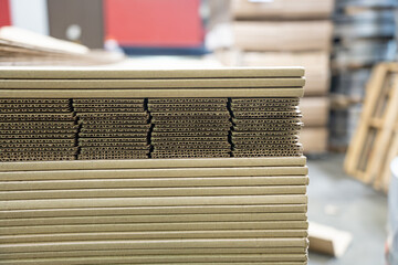 Stacks of Flat Corrugated paper boxes for shipping