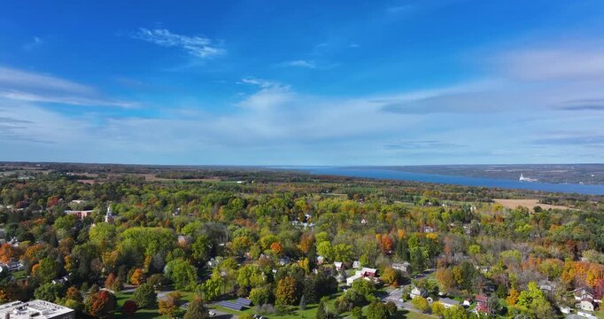 Trumansburg, NY, USA - October 17, 2025:  Aerial video over the Village of Trumansburg, NY with view of Cayuga Lake
