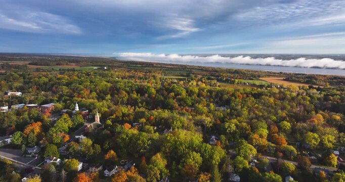 Trumansburg, NY, USA - October 17, 2025:  Aerial video over the Village of Trumansburg, NY with view of Cayuga Lake
