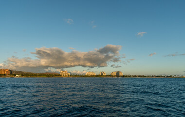 Scenic panoramic west Oahu vista at sunset viewed from the boat, Hawaii