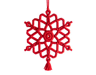 Intricate, vibrant red knotted ornament shaped like a six-pointed star, hanging