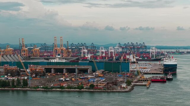 Aerial view shipping port boat with crane transport industry