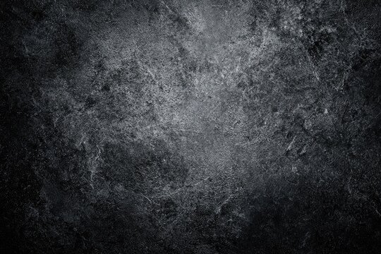 Dark, textured surface with mottled gray and black tones (1)