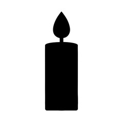 burning candle on black background