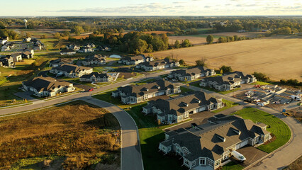 Building residential neighborhood. Aerial view of new construction houses. Establishing shot of Midwestern United States.