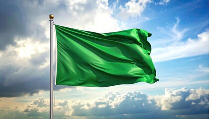 Vibrant Green Flag Fluttering Against A Dramatic Cloudy Sky With Sun Rays Shining Through
