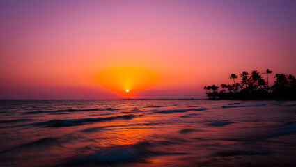 Tropical sunset over the ocean with palm trees silhouetted against the vibrant sky