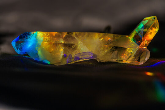 Long quartz crystal cluster in prism light