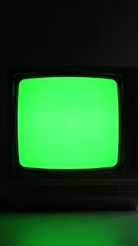 Retro TV Power-Up with turn on the noise at beginning and switch to a green screen night horror climate distortion, overlay, glitch, static noise, scan lines black background, 4k animated video loop