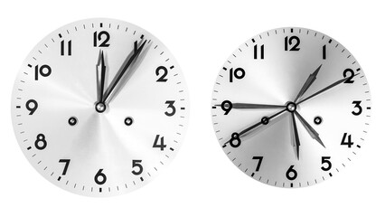 Two metallic clock faces showing different times, one at midnight and one with multiple overlapping hands, symbolizing time change, confusion, and abstract concept of hours and moments.
