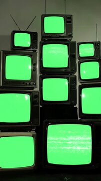 Retro Tech Abstraction with pile of tvs green screen turning on and off distortion, overlay, glitch, static noise, scan lines black background, 4k animated video loop