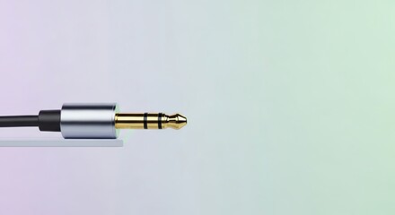 Naklejka premium Close-up of Audio Jack: Gold-Plated Connector on Gradient Background.