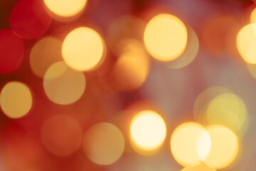 Yellow, white, and orange bokeh – abstract holiday background with defocused Christmas lights © Lyudmyla