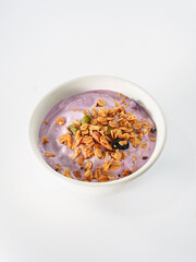Yogurt Granola grains and Almonds bean in bowl on white background. Food for energy breakfast, brunch snack. Healthy ingredients food contains nutrition protein, vitamins. Footage lifestyle restaurant