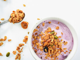 Yogurt Granola grains and Almonds bean in bowl on white background. Food for energy breakfast, brunch snack. Healthy ingredients food contains nutrition protein, vitamins. Footage lifestyle restaurant