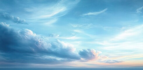 Fototapeta premium Expansive sky with soft clouds spreading across a serene blue horizon at sunset, evoking calmness and tranquility