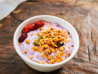 Yogurt Granola grains and Almonds bean in bowl on white background. Food for energy breakfast, brunch snack. Healthy ingredients food contains nutrition protein, vitamins. Footage lifestyle restaurant