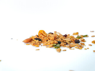 Granola mix grains Almonds bean on isolated white background. Food for energy breakfast, brunch snack. Healthy ingredients food contains nutrients protein, vitamins. Morning nutrition lifestyle food 