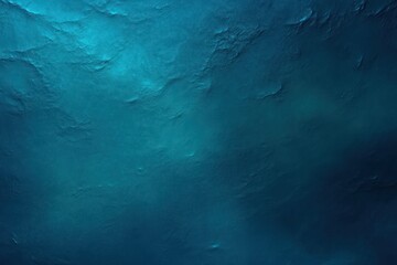 Underwater scene showing deep blue ocean water with subtle light rays and textured water surface