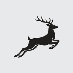 Fototapeta premium Black Silhouette of a Jumping or Leaping Deer with Antlers