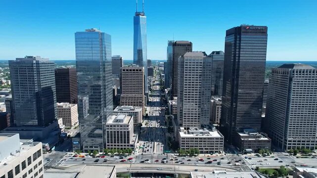 Aerial View of Modern Skyscrapers in a Bustling Cityscape Under Blue Sky.