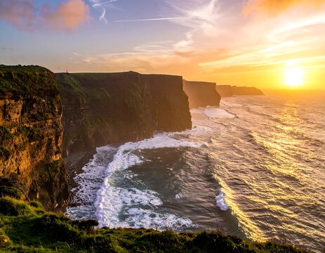 Coastal cliffs with crashing waves and sunset hues - Powered by Adobe