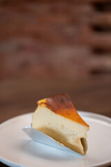 Burnt Basque cheesecake served on plate on the table