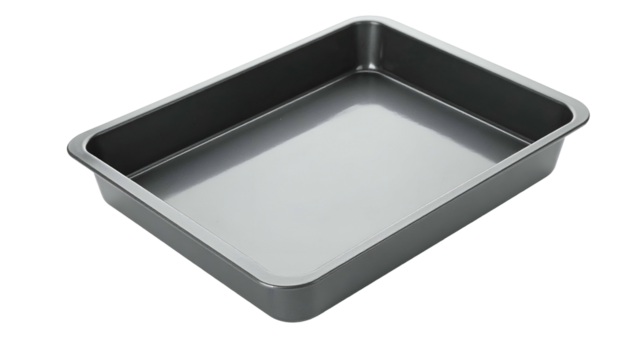 Shiny metallic rectangular baking pan angled on a black backdrop